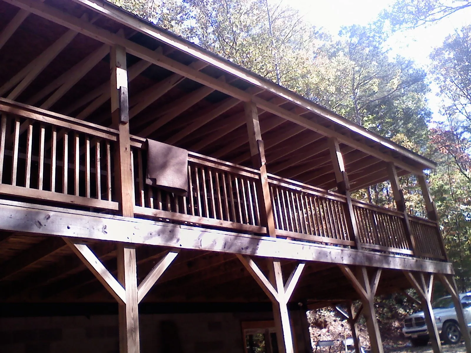 Timber framing under a new elevated porch and deck — Roof Leak Repair in Farmland by Roofing Brothers